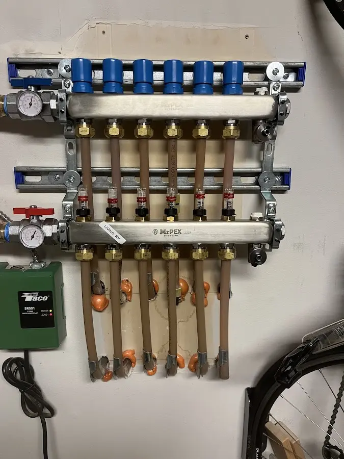 Plumber performing Water Heater Repair at a residential property in Essex Junction